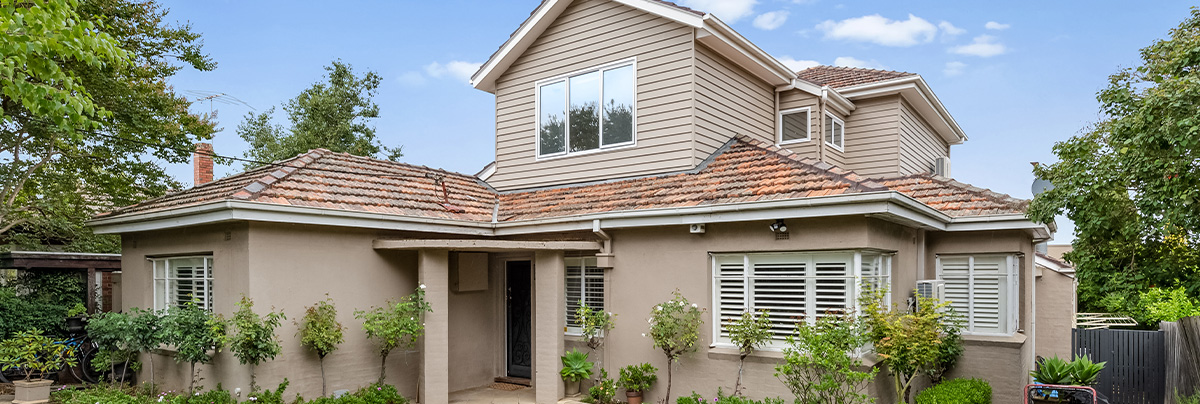 A beige two-storey house