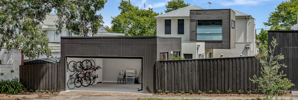 Brown wooden fence and garage