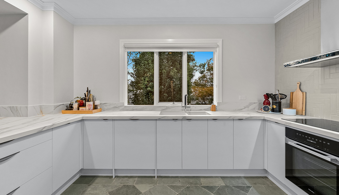 Wide open kitchen with patterned tiles