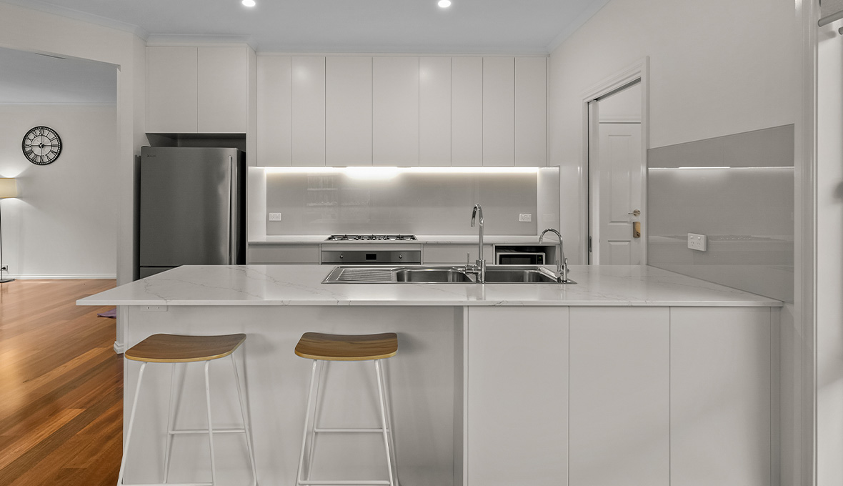 White kitchn with underlit cabinetry