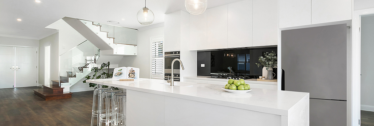 open plan kitchen renovation with modern white colours