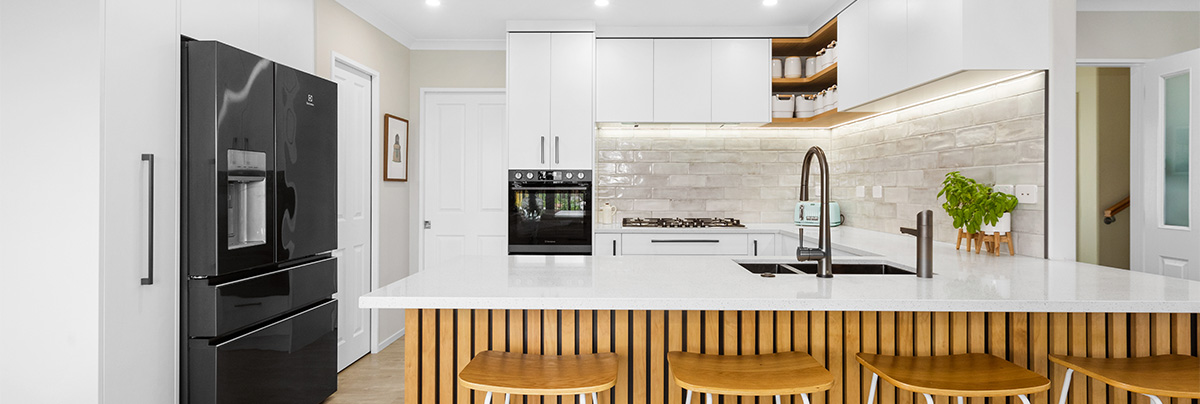 Kitchen with polished white tiles