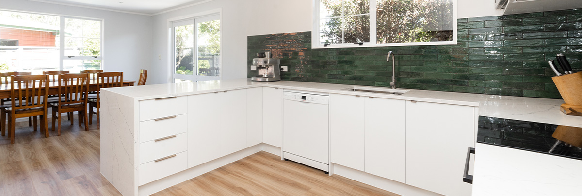 Kitchen with green tiles