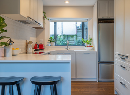 modern white and bright kitchen with brick details