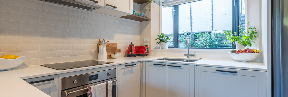 modern white and bright kitchen with brick details