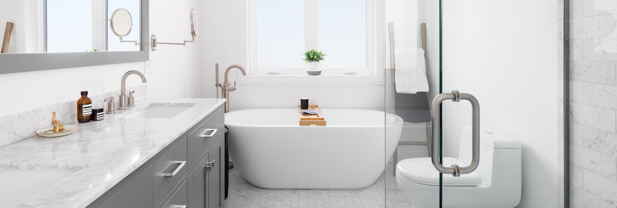 bright modern bathroom with small bathtub and marble sink