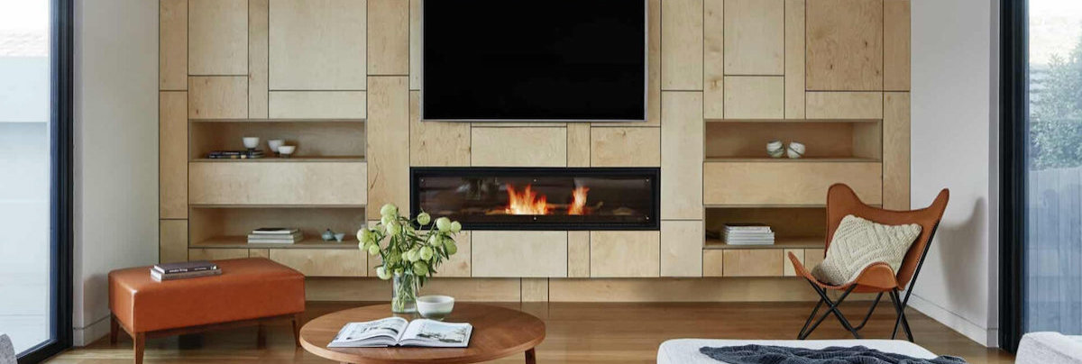 tv and fireplace on wooden wall