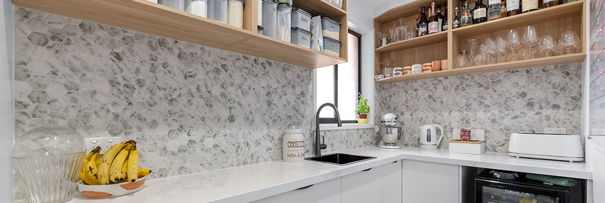 Kitchen with overhead storage and mini fridge