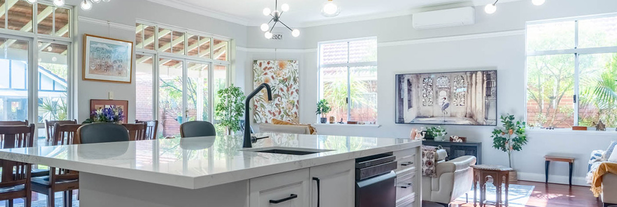 Open-plan living room with kitchen and couches