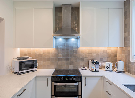 Kitchen with splashback lighting 