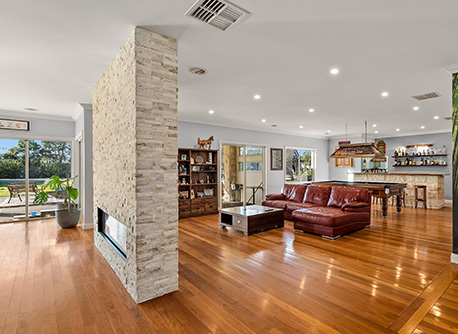 Living room with bar and shiny leather couches