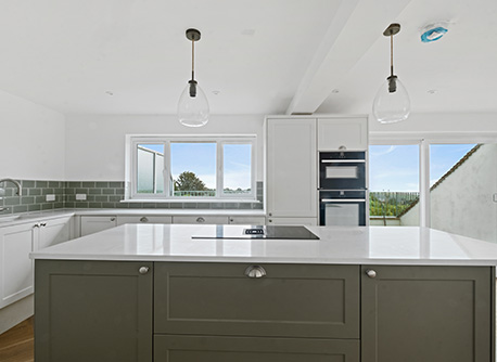 Kitchen with marble benchtop and splashback