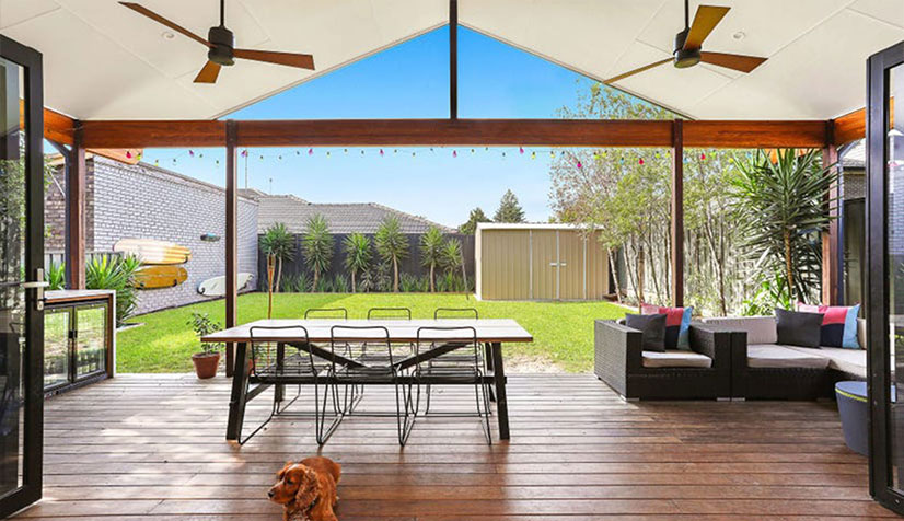 Renovating a deck with garden space and a small garage in Nelson.
