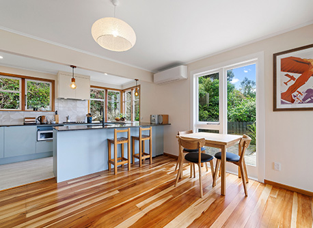 kitchen with wooden floor and baby blue cabinets