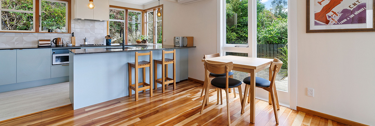 kitchen with wooden floor and baby blue cabinets