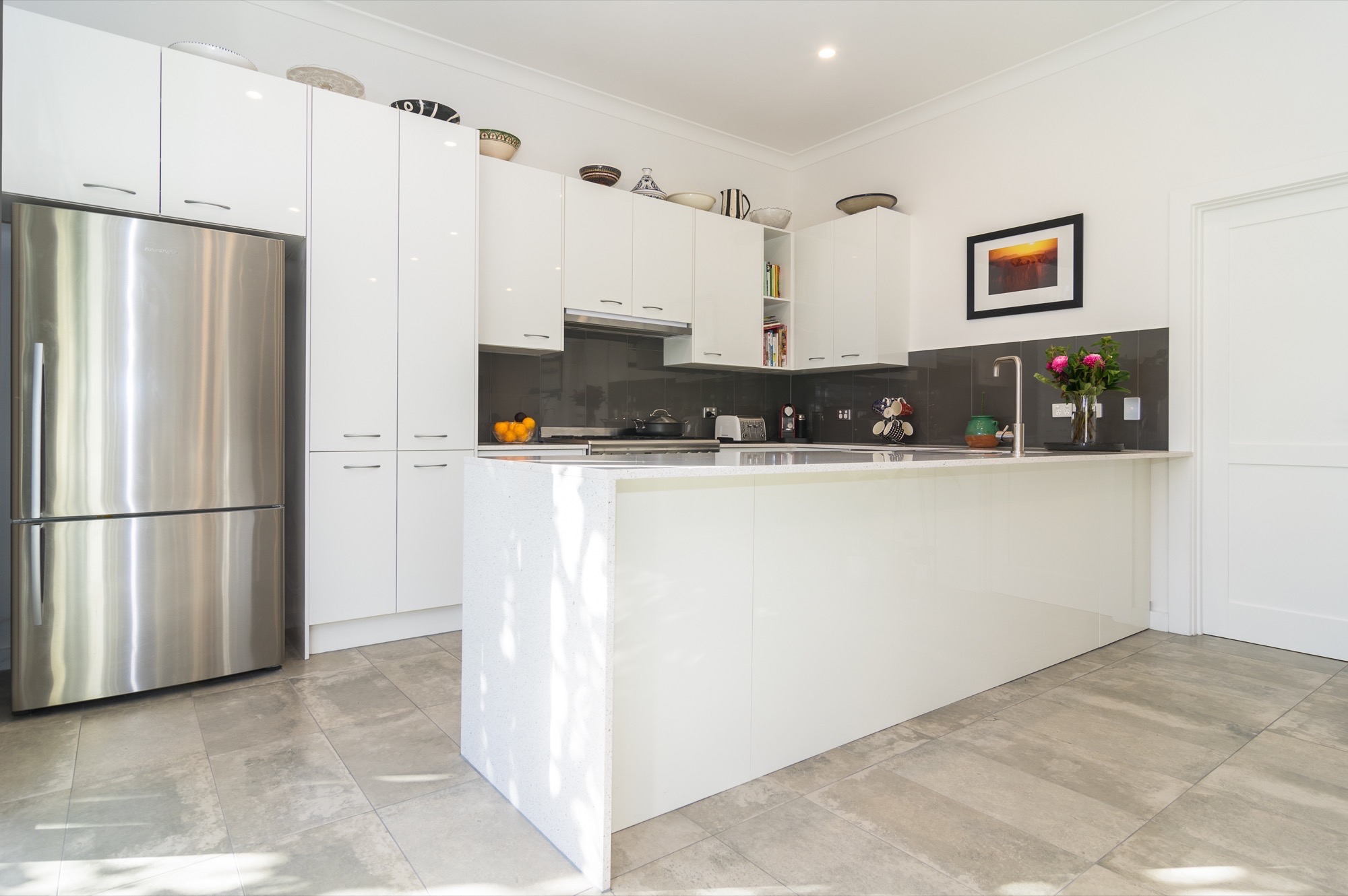 White and charcoal coloured kitchen