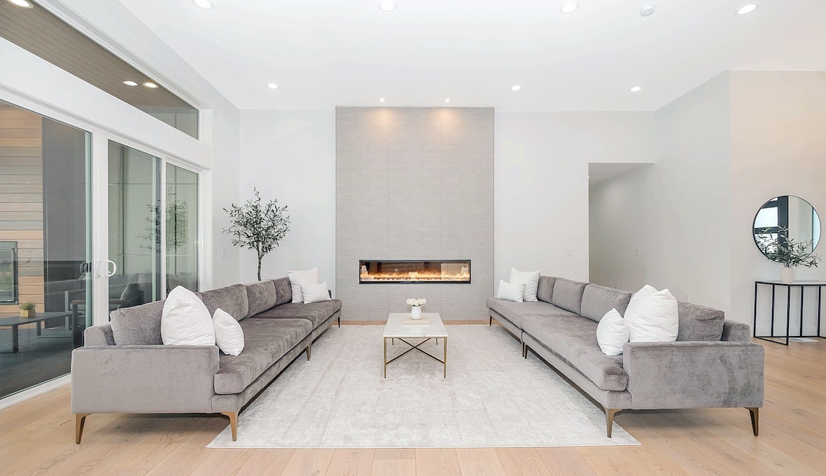 bright open-living lounge area with fire place