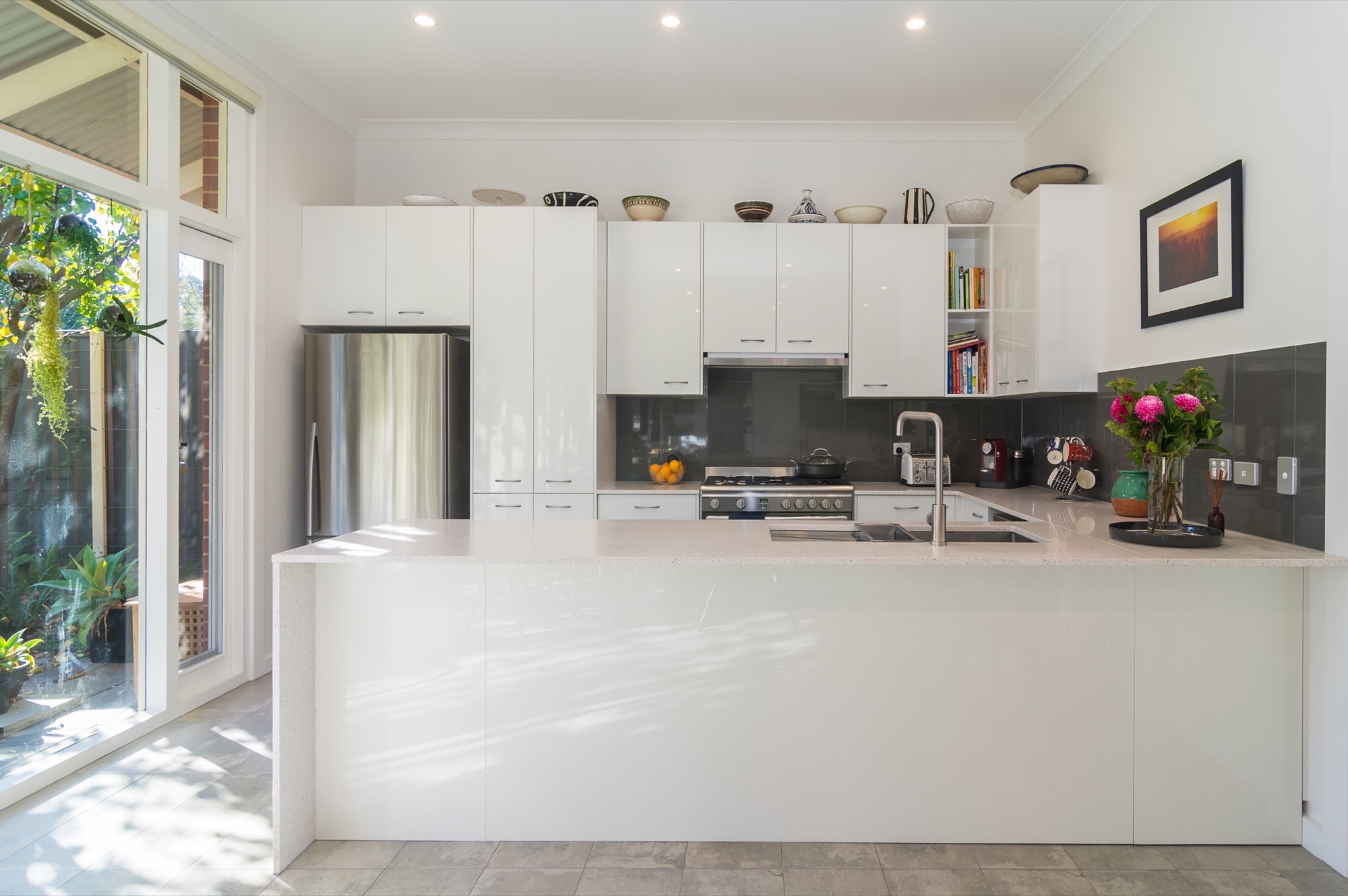 Renovated White kitchen with modern sink and cabinets
