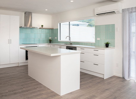Modern small kitchen with turquoise tiles and white kitchen island