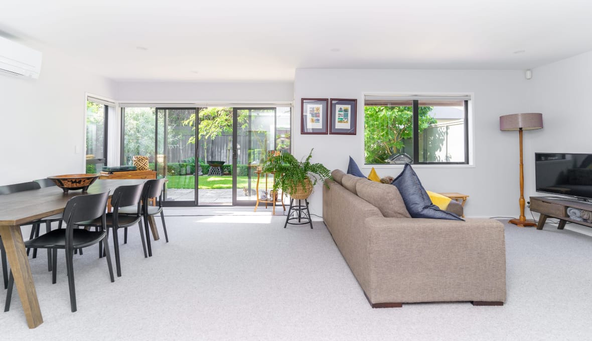 Stunning living room renovation with a wall attachment and covered firewood heaters