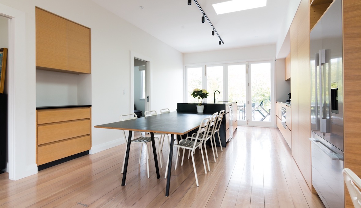 extended kitchen with dinner table and kitchen island