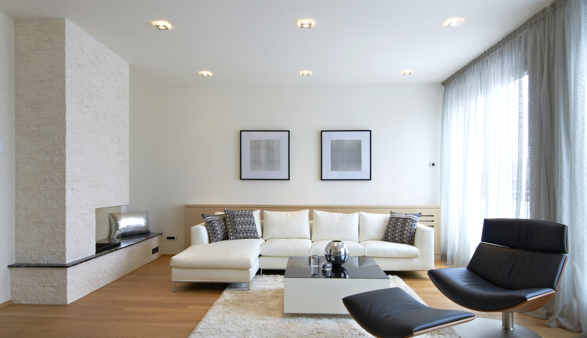 modern living room with white couch and fireplace
