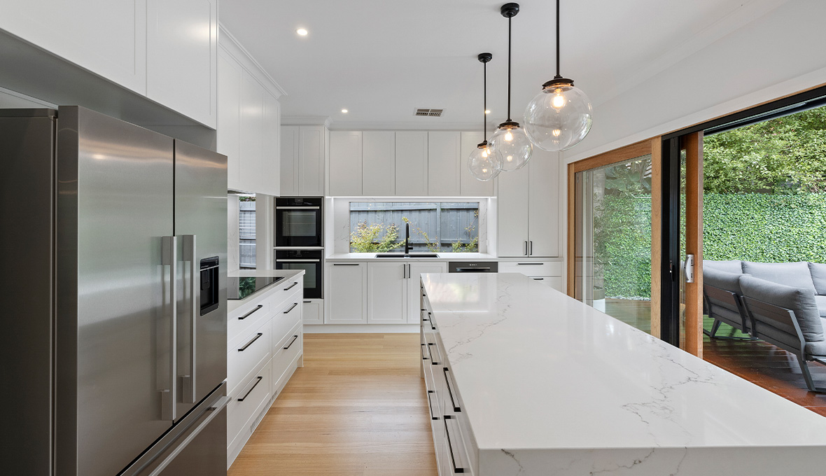 Open plan kitchen with waterfall benchtop