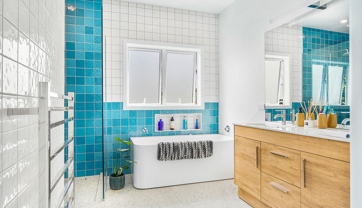 turquoise tiles funky style bathroom with bathtub