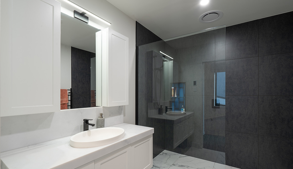 bathroom with contrast colours and bespoke marble basins