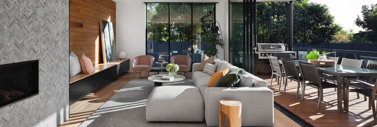 living room extension leading out to an outdoor dining area with sliding doors