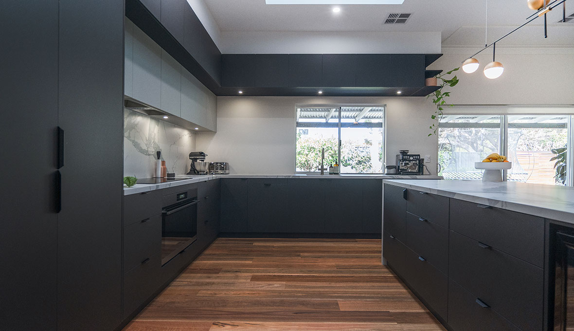 modern kitchen with black cabinets