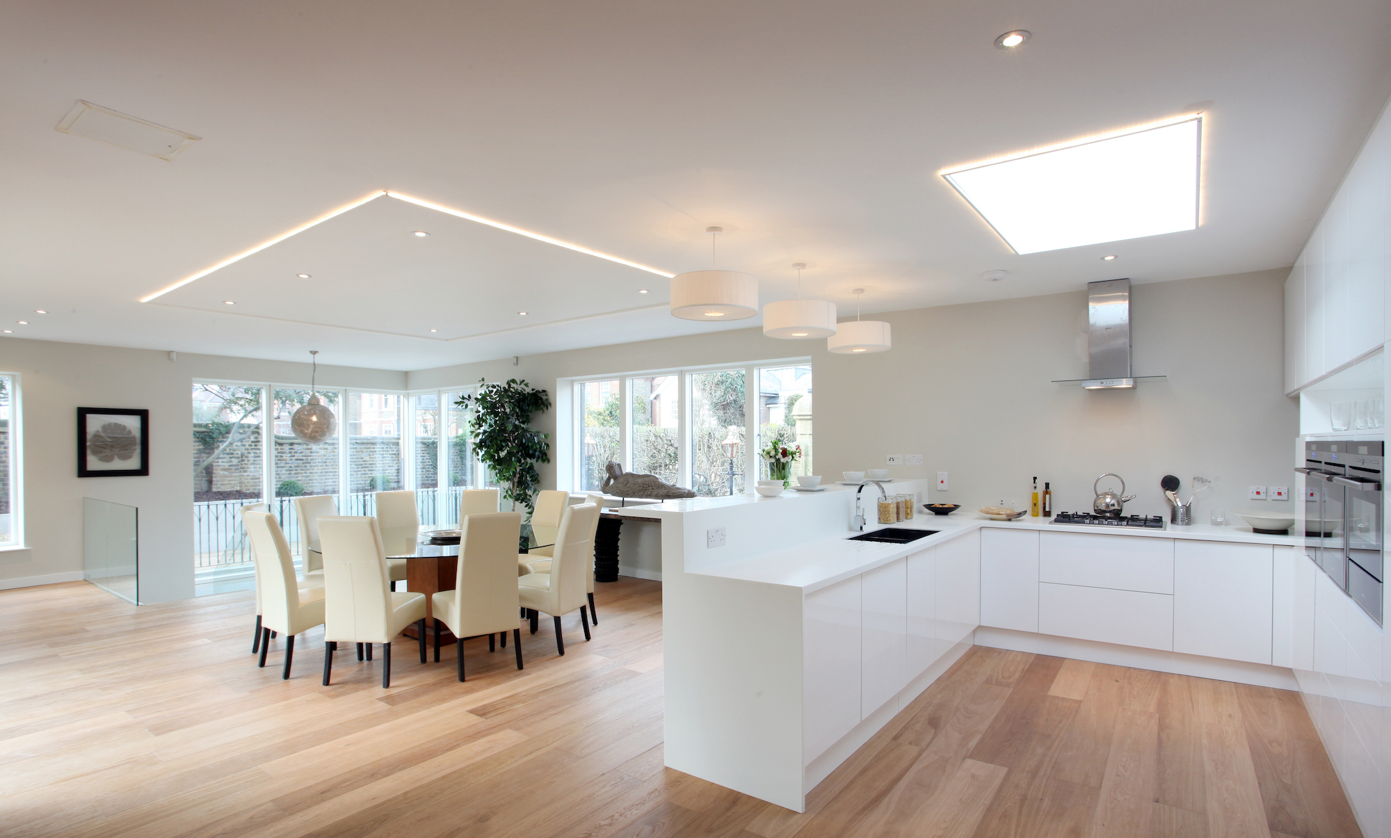 open plan kitchen with skylight and spotlights in the ceiling