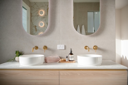 Bathroom renovation with circular mirrors