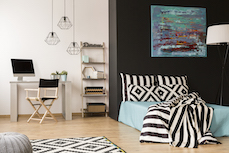 A livingroom with green colour block wall
