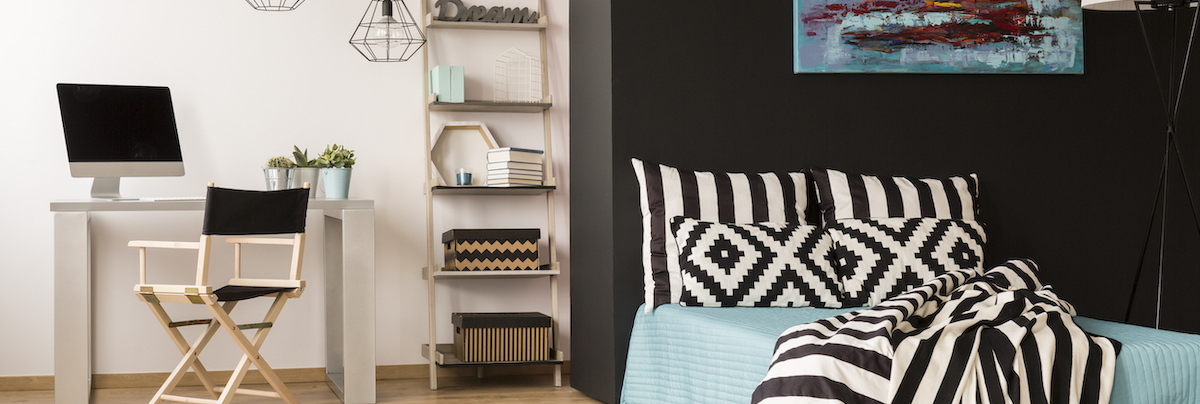 A livingroom with green colour block wall