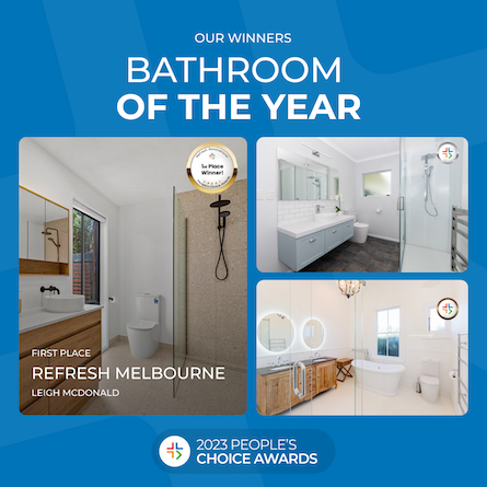 Bathroom with floor to ceiling tiles and double vanoty