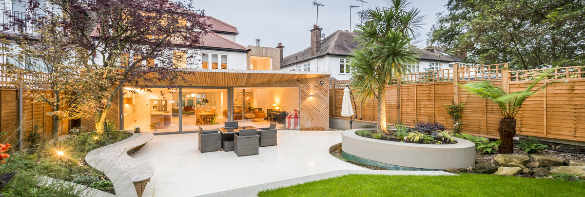 A large garden living space added on to a home and terrace area.