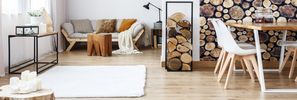 A cosy living room with rug, candles, rug and a homely feel.