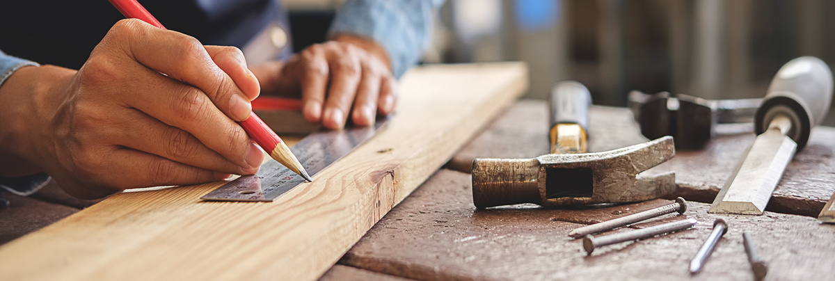 A carpenter working and his tools