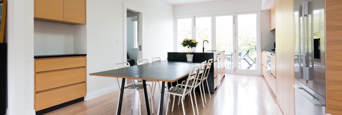 Open-plan kitchen with timber accents