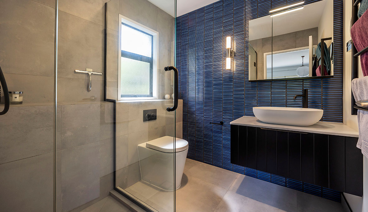 Blue bathroom tile feature wall