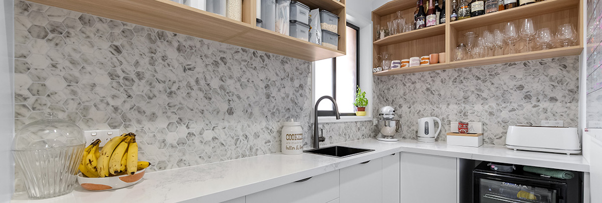 Walk-in pantry with marble splashback
