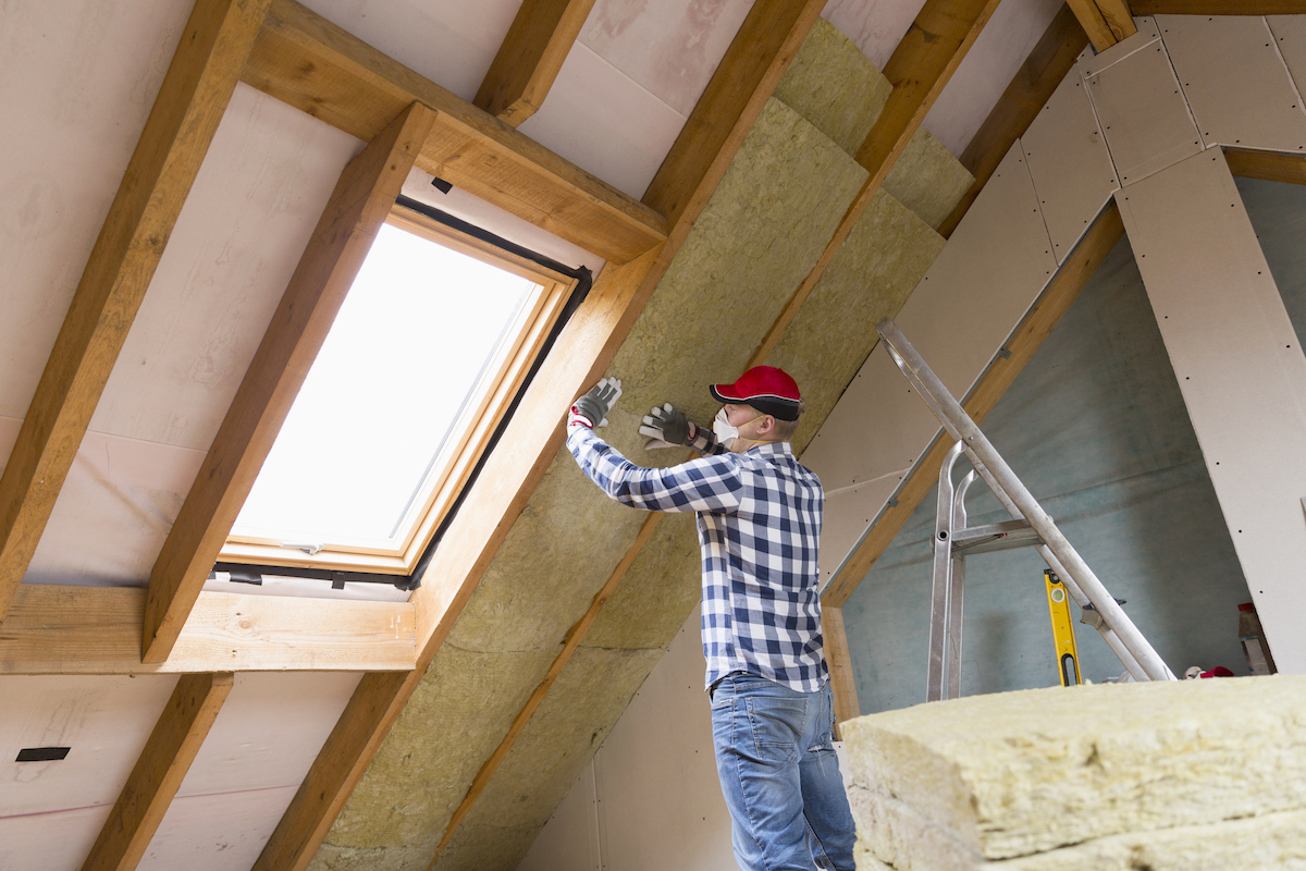 Man doing DIY insulation