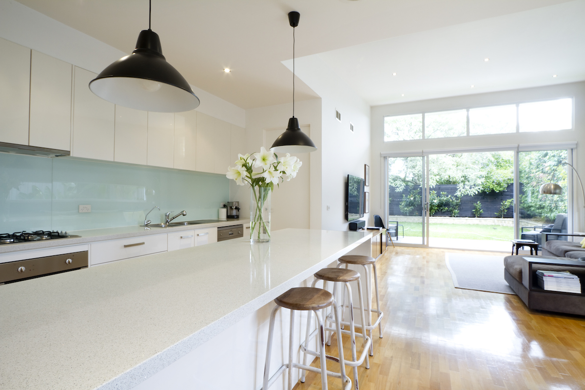 Kitchen with turquoise splashback