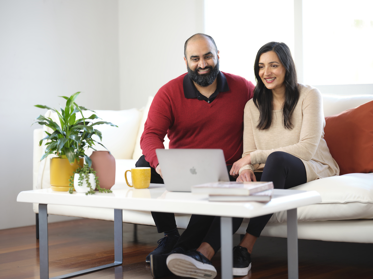 Couple looking at laptop