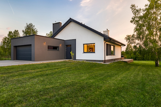 House exterior with lush green lawn 