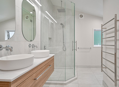 bathroom with modern vanities and glass shower cabinet