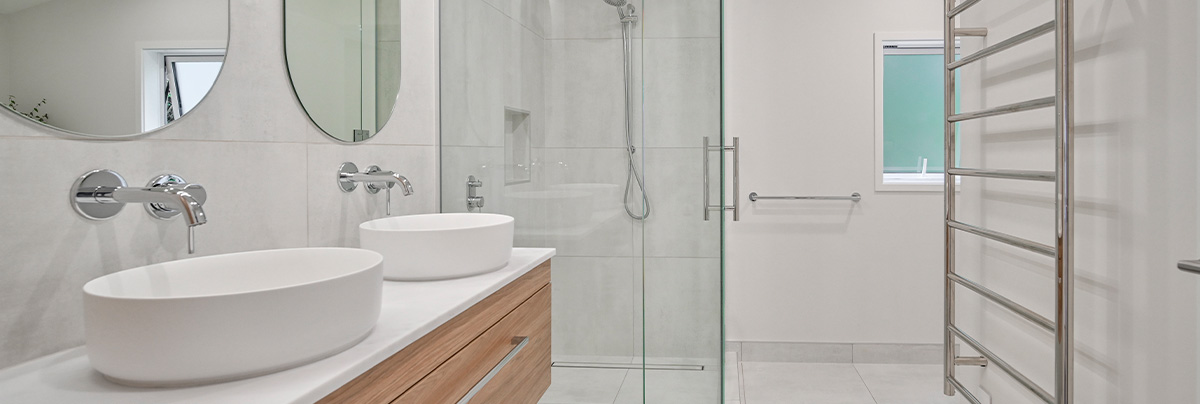 bathroom with modern vanities and glass shower cabinet