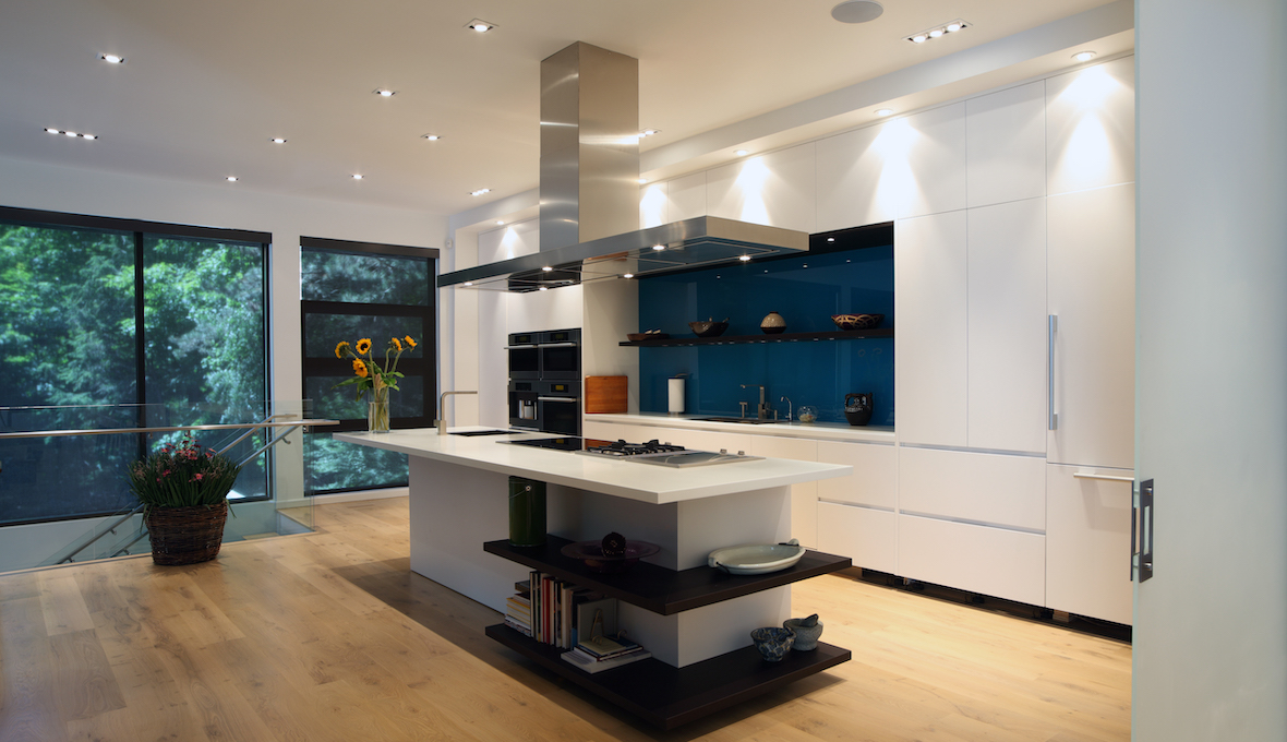 modern second-storey kitchen with kitchen island and blue backsplash