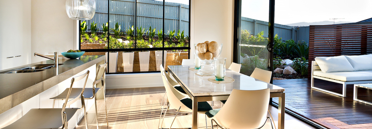 Open plan kitchen with dining table